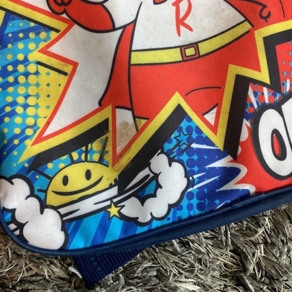 Kids Ryan’s World backpack small spot on front might be washable minimal usage. - Picture 2 of 5
